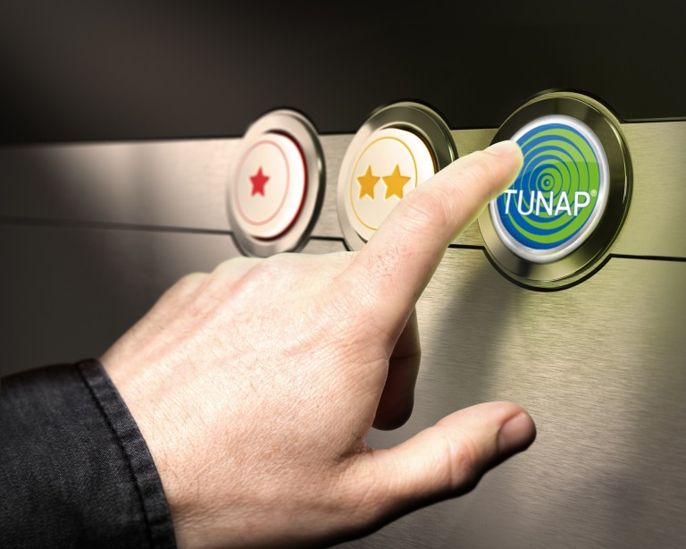 TUNAP решения Hand pointing at a button with TUNAP writing